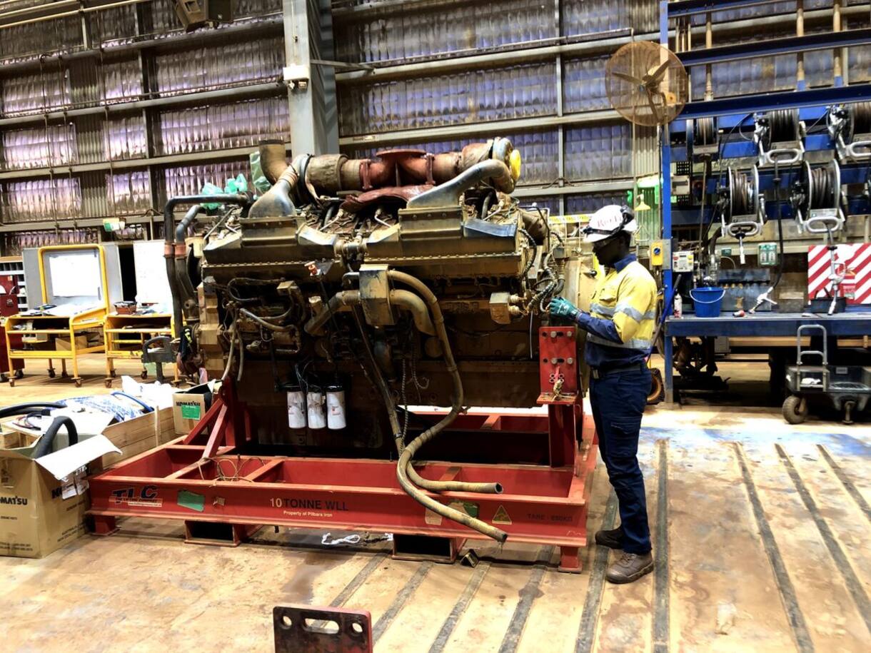 Diesel engine on a stand being rebuilt in the workshop