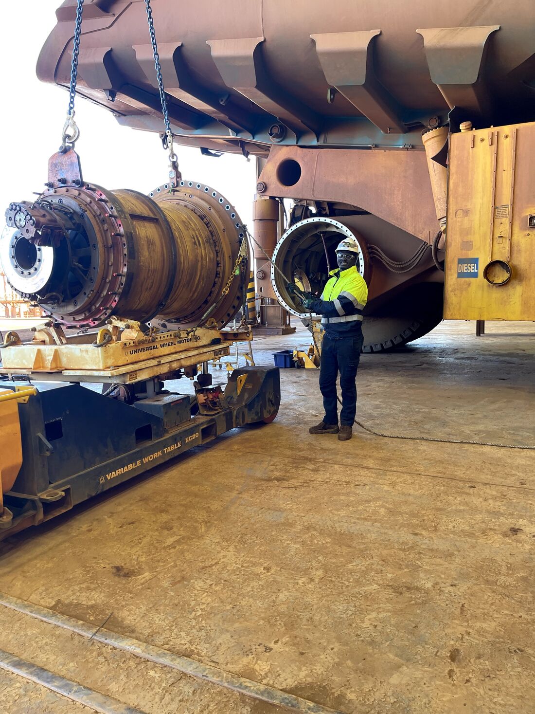 Final drive being lifted from under a haul truck
